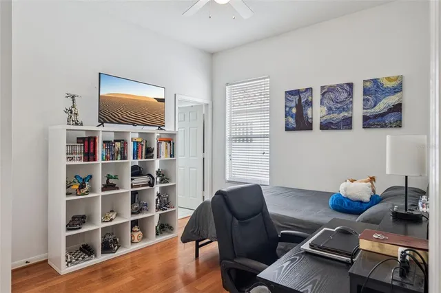 a bathroom with a sink vanity mirror and toilet