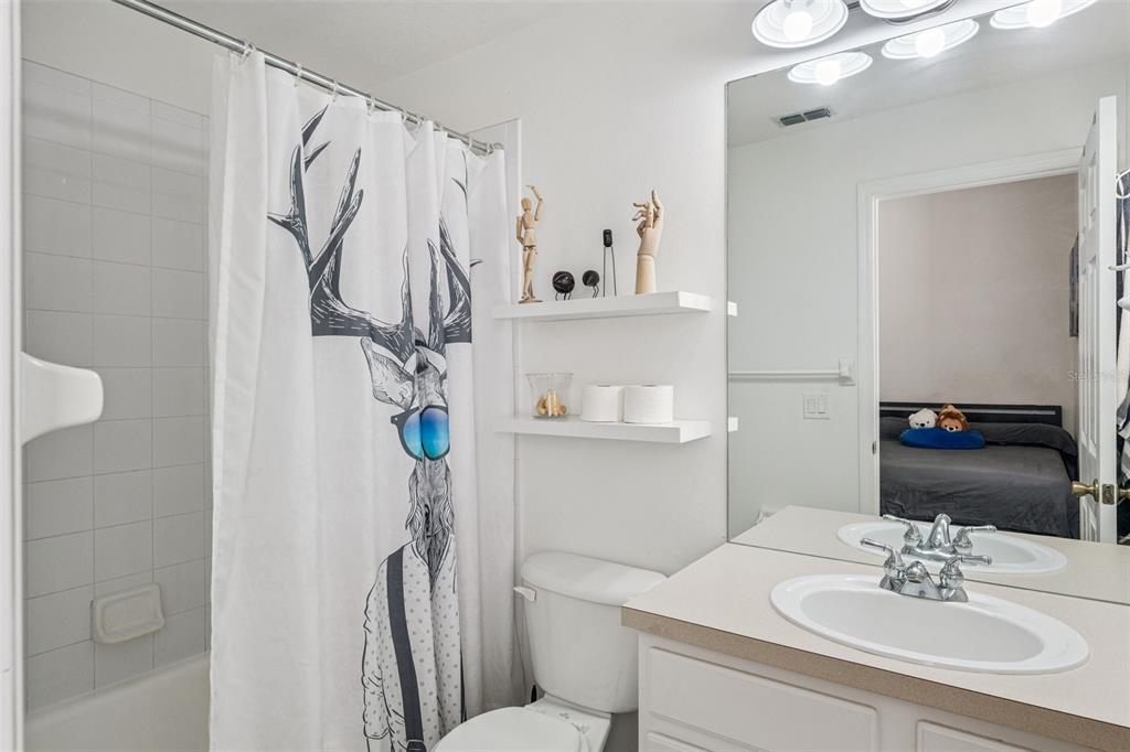 11162 Ledgement Lane Windermere, FL 34786 - Photo 25 of 55 a bathroom with a sink vanity mirror and toilet