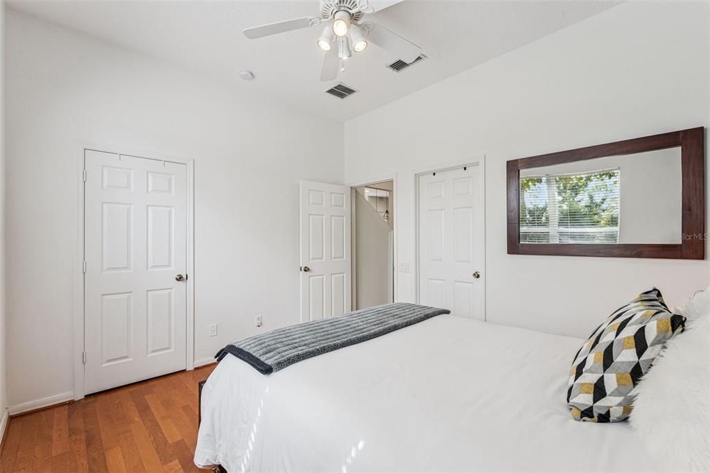 11162 Ledgement Lane Windermere, FL 34786 - Photo 29 of 55 a bedroom with a bed and a chandelier