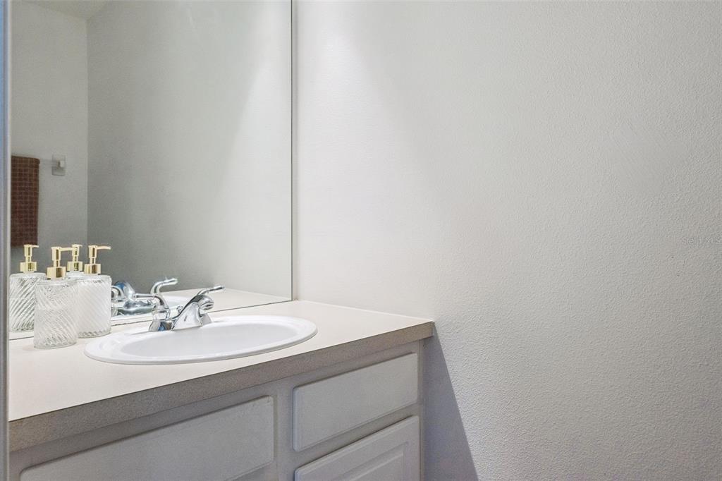 11162 Ledgement Lane Windermere, FL 34786 - Photo 34 of 55 a bathroom with a sink and a mirror