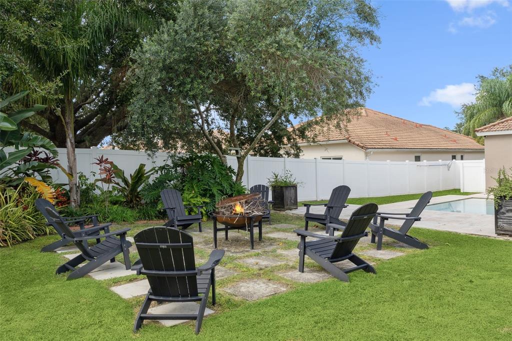 11162 Ledgement Lane Windermere, FL 34786 - Photo 41 of 55 a view of a backyard with furniture and a fire pit
