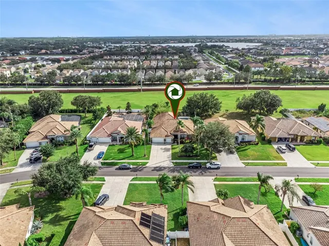 an aerial view of residential houses with outdoor space and entertaining space