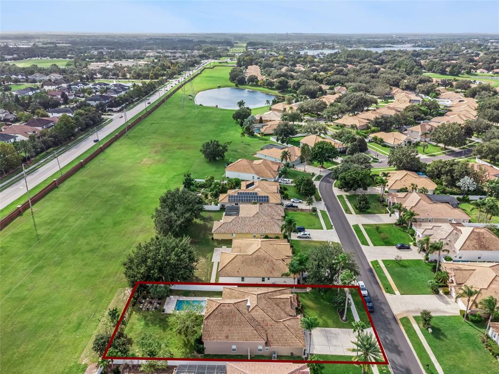 11162 Ledgement Lane Windermere, FL 34786 - Photo 47 of 55 an aerial view of residential houses with outdoor space and trees