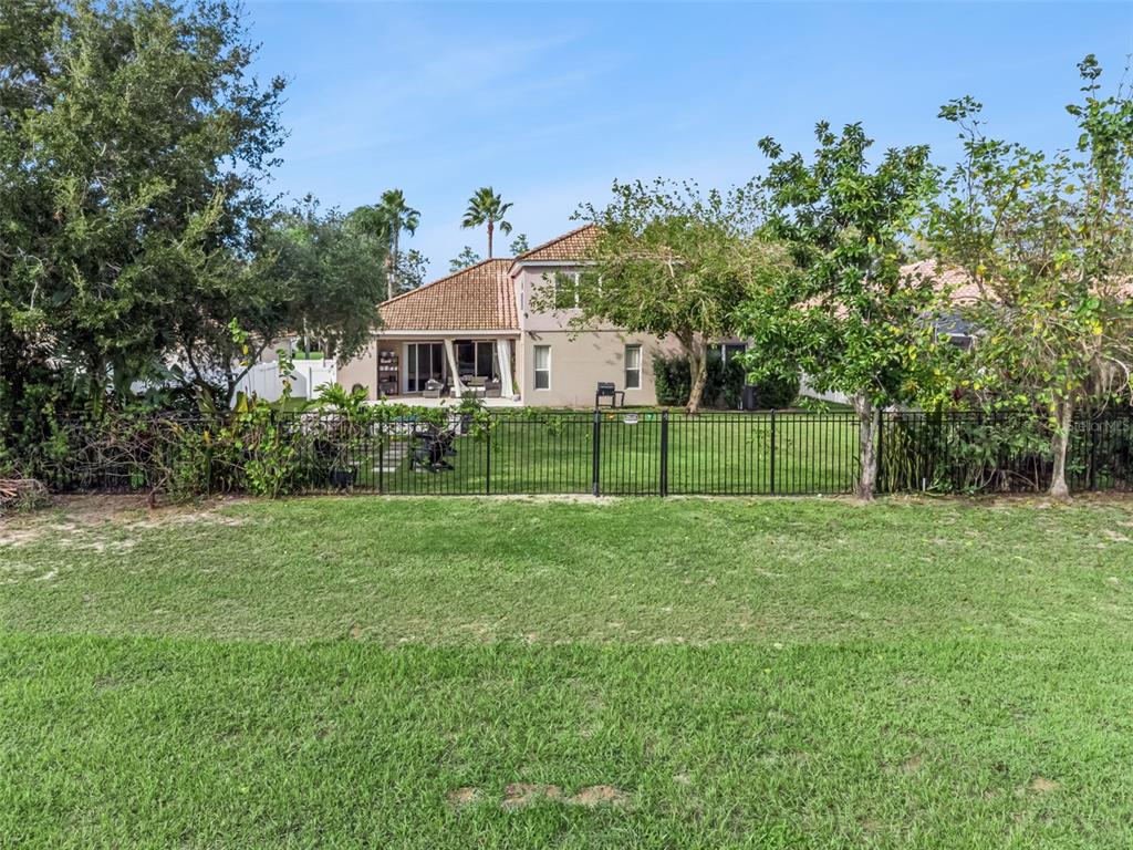 11162 Ledgement Lane Windermere, FL 34786 - Photo 49 of 55 a view of a house with a backyard