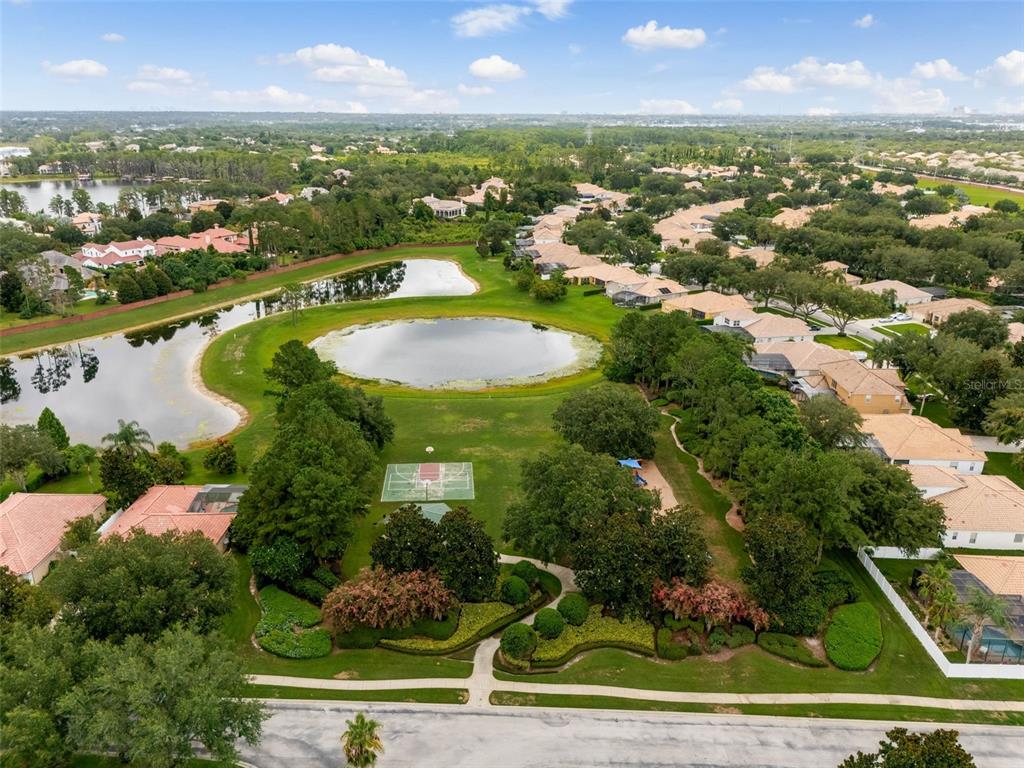 11162 Ledgement Lane Windermere, FL 34786 - Photo 53 of 55 an aerial view of residential houses with outdoor space and river