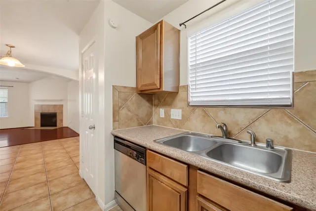 a kitchen with a sink and a white cabinets