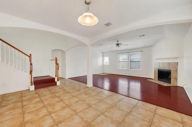 a bedroom with a bed and a fireplace