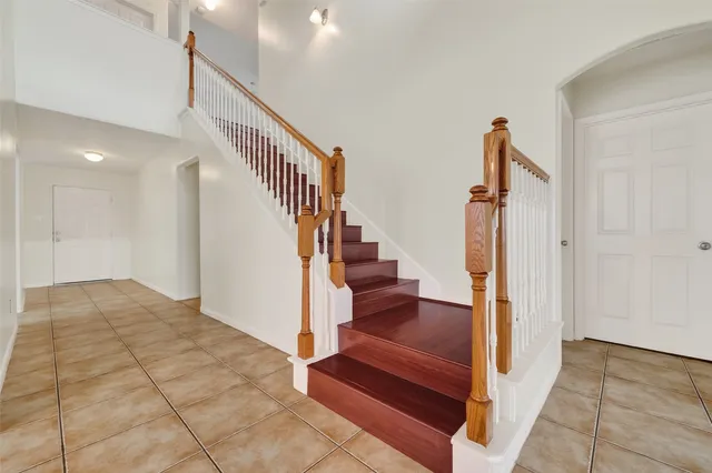 a view of entryway and hall with a rug