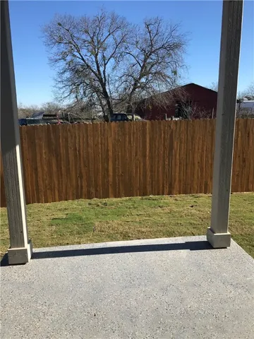 a view of outdoor space with wooden fence