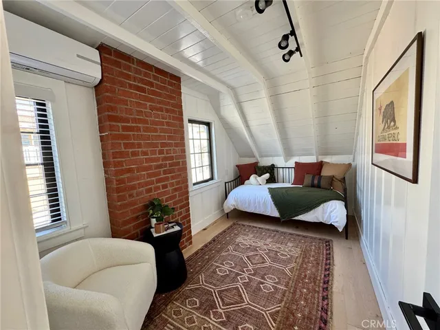 a bedroom with furniture and a couch