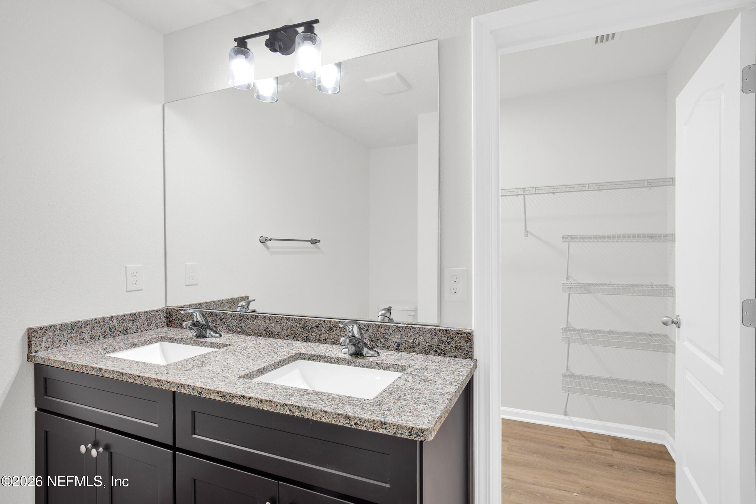 138 Kelly Smith School Road Palatka, FL 32177 - Photo 22 of 52 a bathroom with a granite countertop sink and a mirror