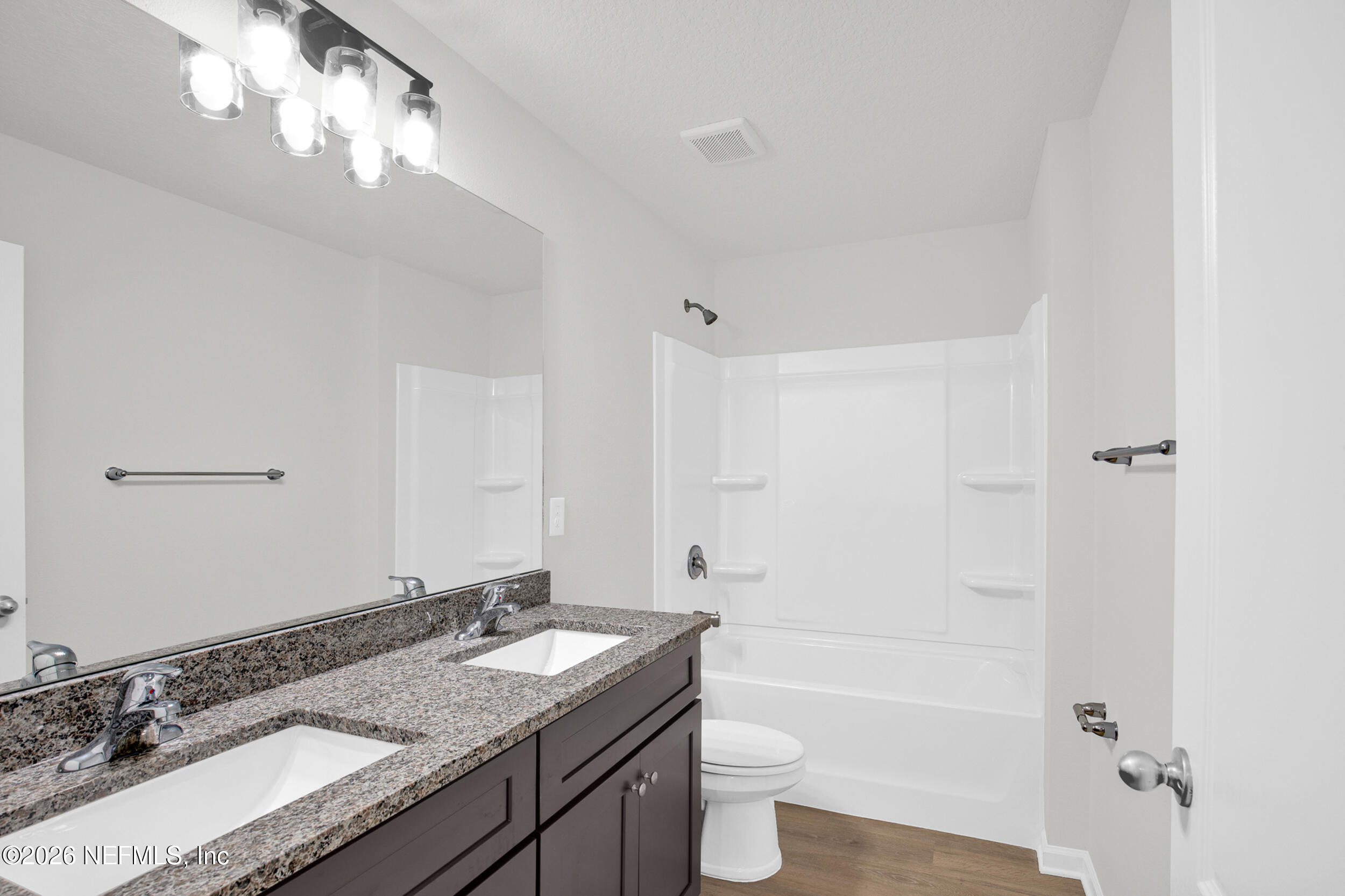 138 Kelly Smith School Road Palatka, FL 32177 - Photo 29 of 52 a bathroom with a granite countertop sink a toilet and shower