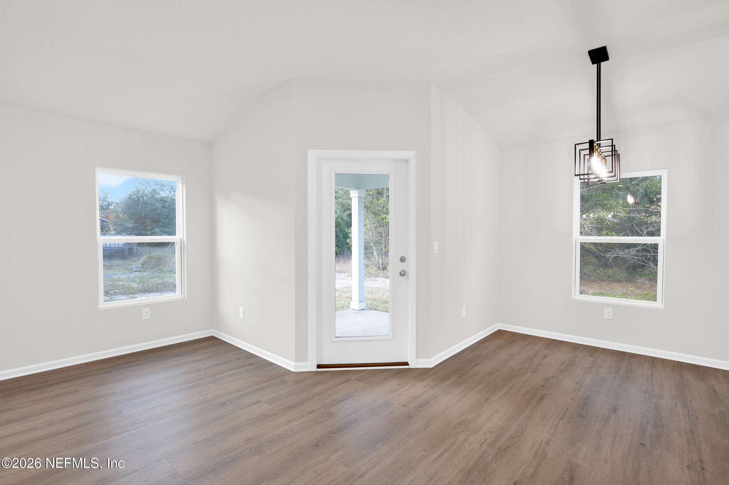 138 Kelly Smith School Road Palatka, FL 32177 - Photo 36 of 52 a view of an empty room with wooden floor and a window