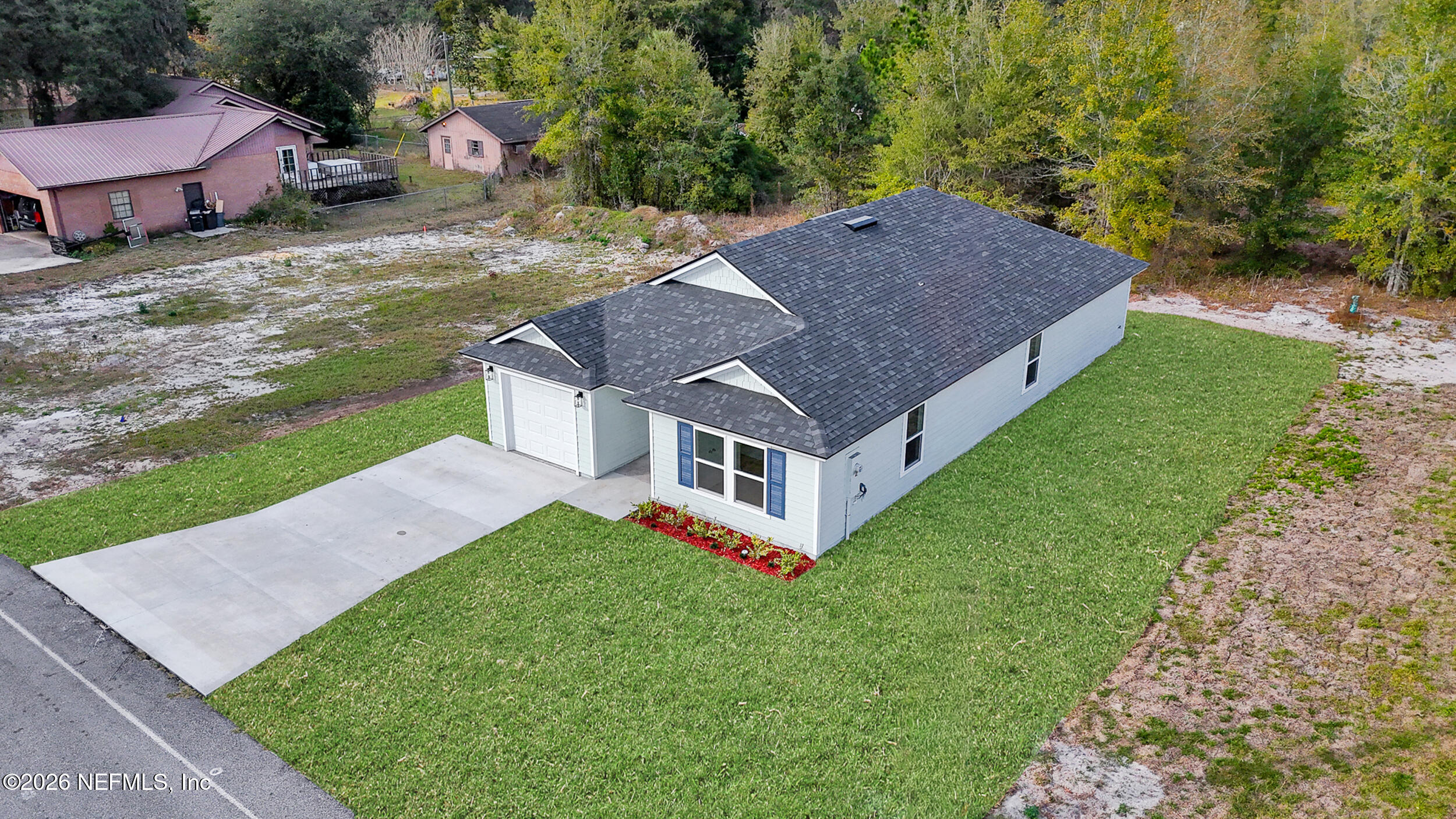 138 Kelly Smith School Road Palatka, FL 32177 - Photo 45 of 52 a aerial view of a house with a yard table and chairs