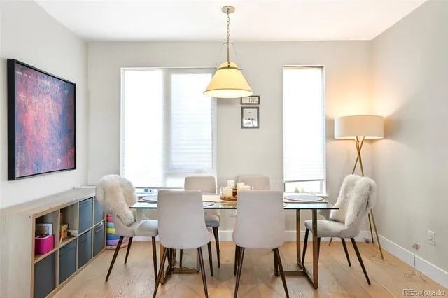 a dining room with furniture and window