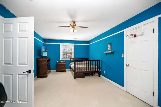 a bedroom with furniture and a window