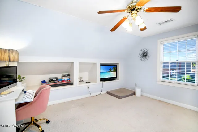 a bedroom with furniture and a chandelier