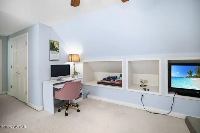 a workspace with furniture and window