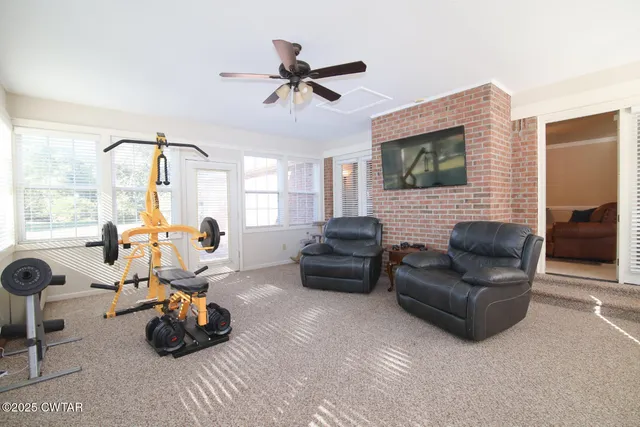 a view of a livingroom with furniture and windows