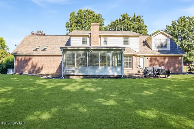 front view of a house with a garden