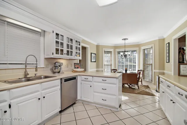 a kitchen with a sink and cabinets