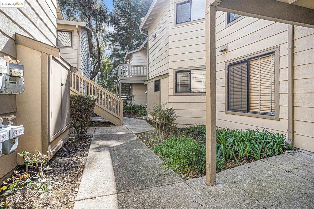 704 Windsor Hercules, CA 94547 - Photo 2 of 9 View of side of property featuring stairs