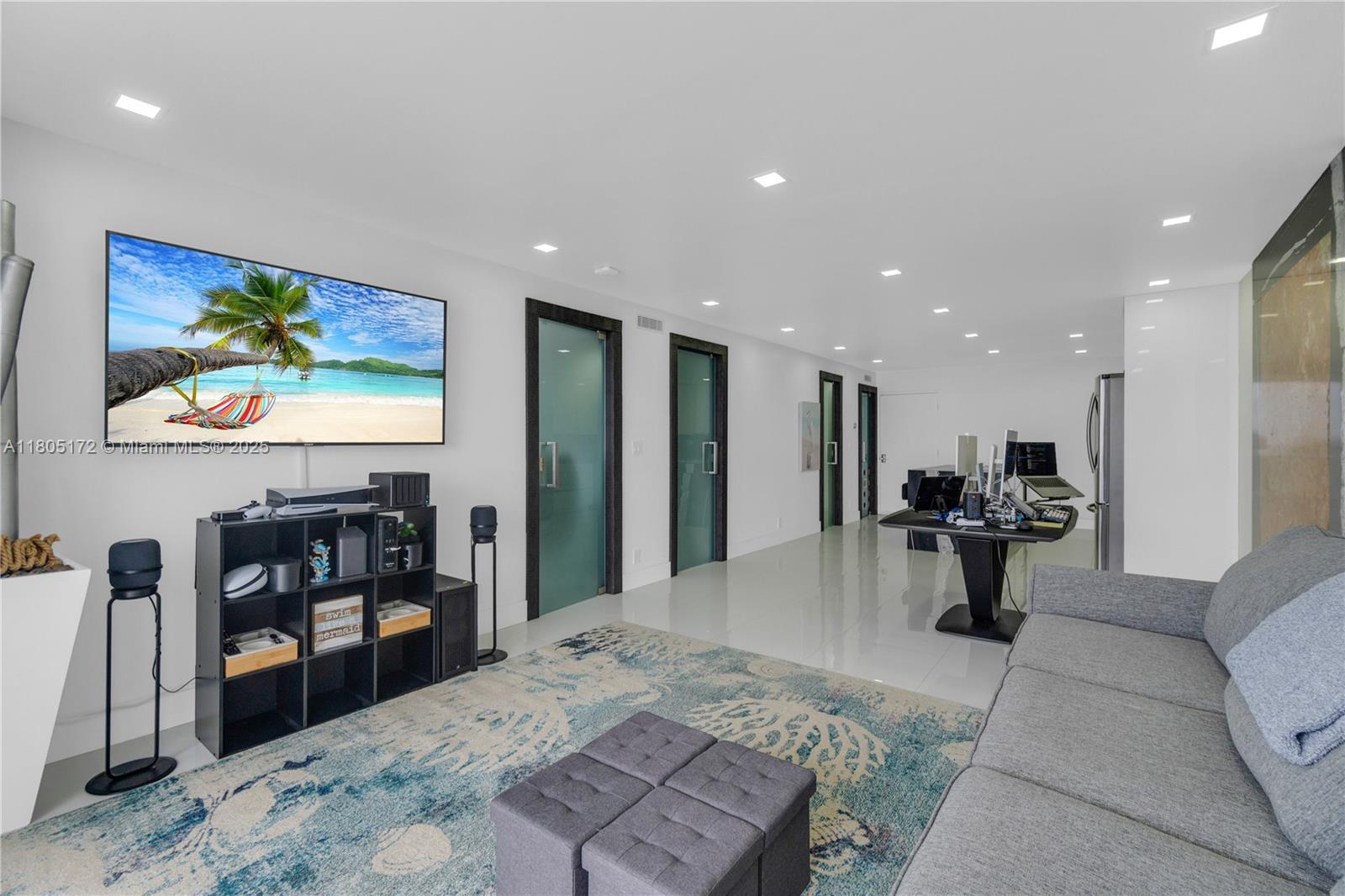400 North Surf Road, Unit 504 Hollywood, FL 33019 - Photo 12 of 44 a living room with furniture and a flat screen tv