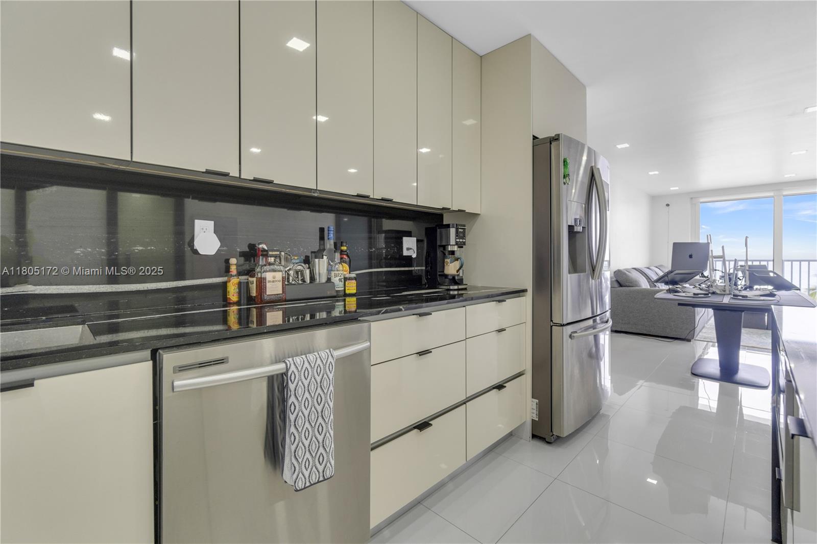 400 North Surf Road, Unit 504 Hollywood, FL 33019 - Photo 13 of 44 a kitchen with stainless steel appliances granite countertop a refrigerator sink and cabinets