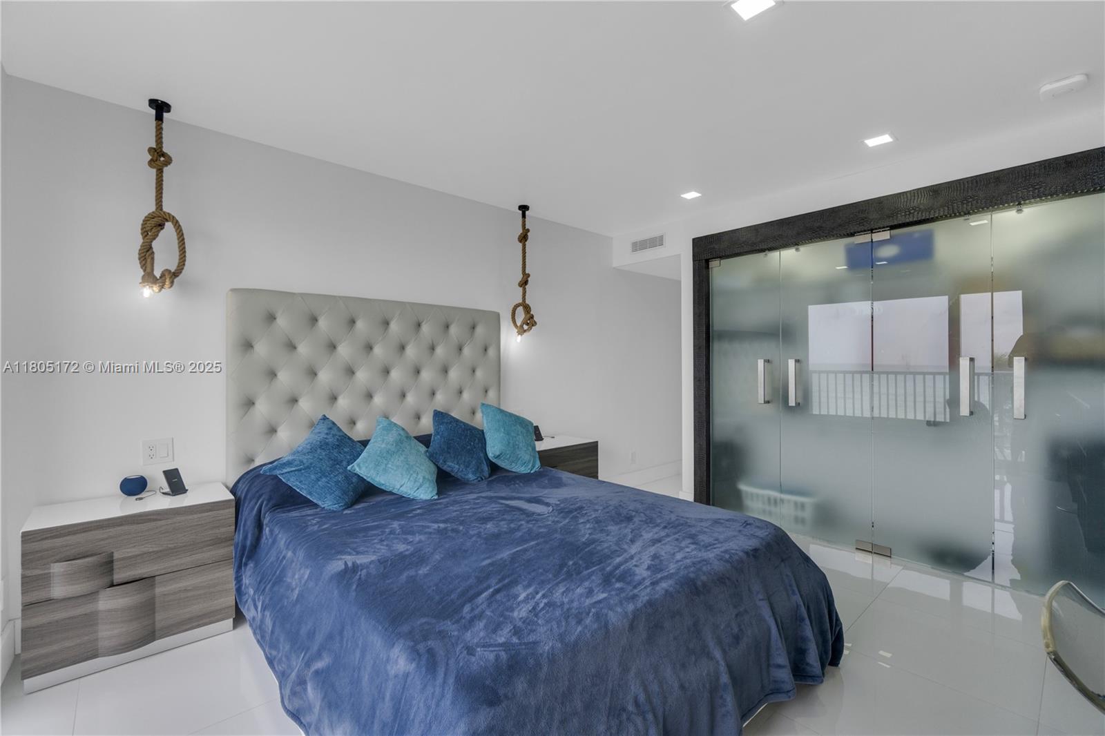 400 North Surf Road, Unit 504 Hollywood, FL 33019 - Photo 17 of 44 a bedroom with a bed and a window