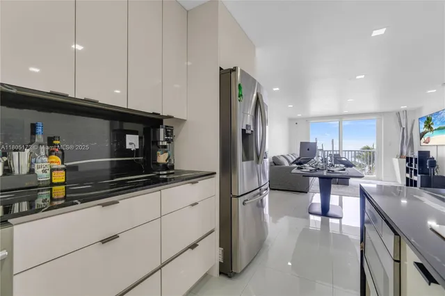 a large kitchen with stainless steel appliances granite countertop a granite counter tops and a sink