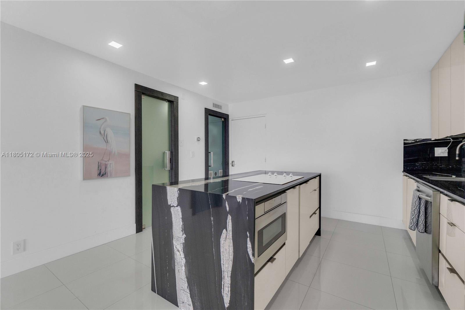 400 North Surf Road, Unit 504 Hollywood, FL 33019 - Photo 22 of 44 a kitchen with stainless steel appliances granite countertop a stove and a refrigerator