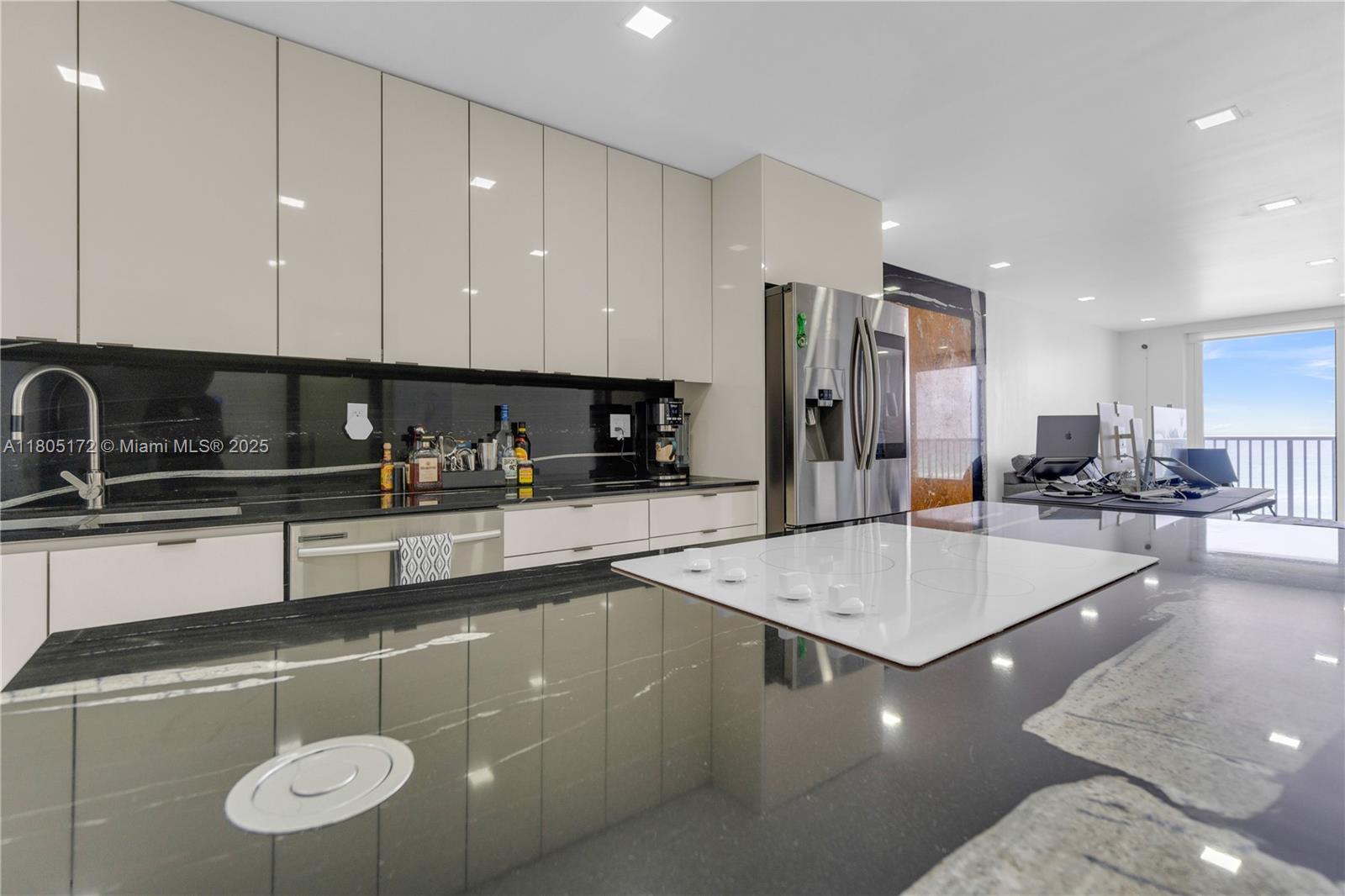 400 North Surf Road, Unit 504 Hollywood, FL 33019 - Photo 23 of 44 a large kitchen with stainless steel appliances granite countertop a granite counter tops and a sink