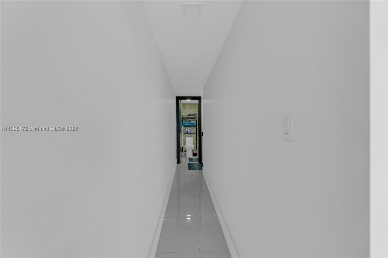 400 North Surf Road, Unit 504 Hollywood, FL 33019 - Photo 27 of 44 a view of a hallway with wooden floor