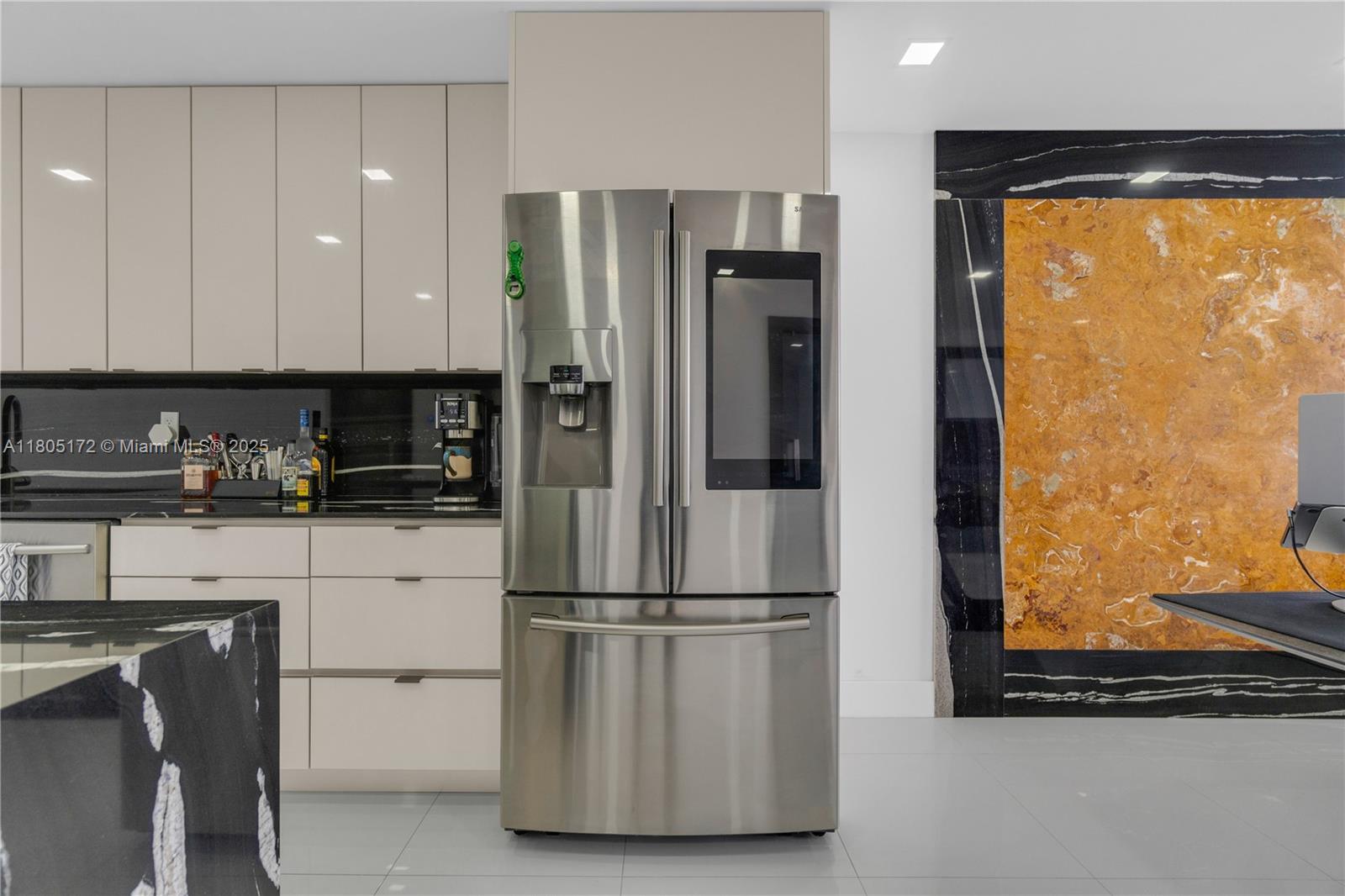 400 North Surf Road, Unit 504 Hollywood, FL 33019 - Photo 7 of 44 a kitchen with appliances a refrigerator and a window