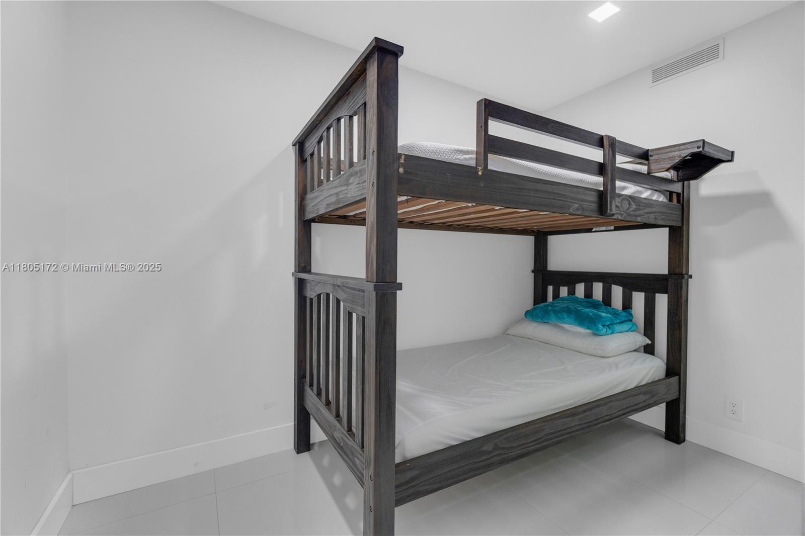 400 North Surf Road, Unit 504 Hollywood, FL 33019 - Photo 8 of 44 a bedroom with bunk bed