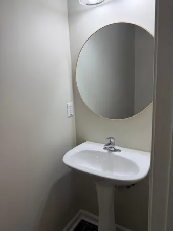 a bathroom with a sink and mirror