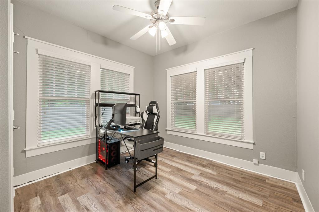 800 North Clements Street Gainesville, TX 76240 - Photo 18 of 27 a view of a workspace with furniture and a window