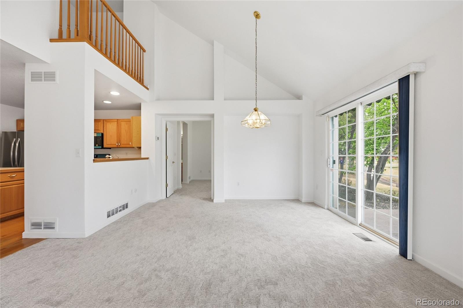 6383 Deframe Way Arvada, CO 80004 - Photo 11 of 49 a view of an empty room with a window