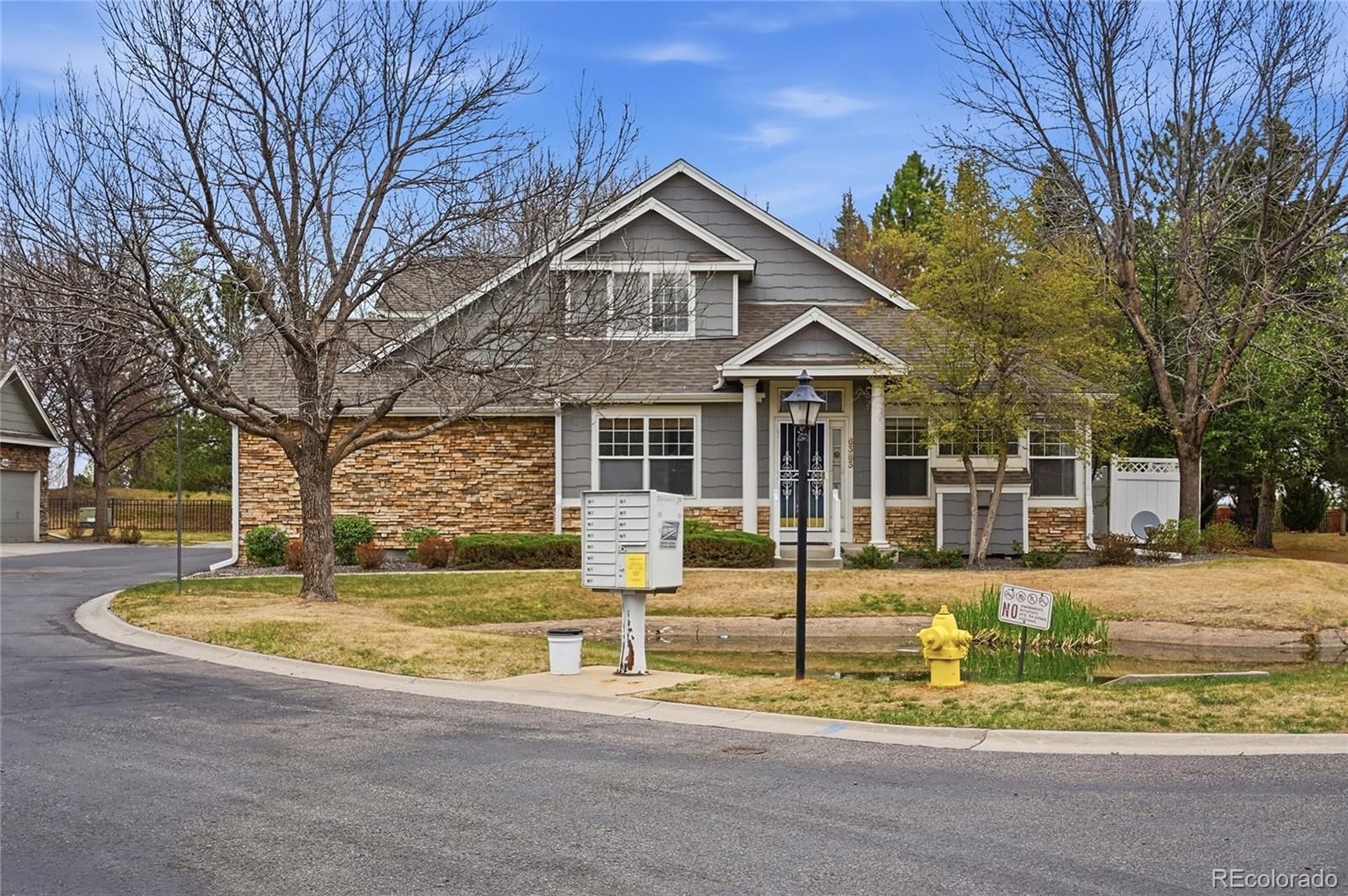 6383 Deframe Way Arvada, CO 80004 - Photo 2 of 49 a front view of a house with a yard
