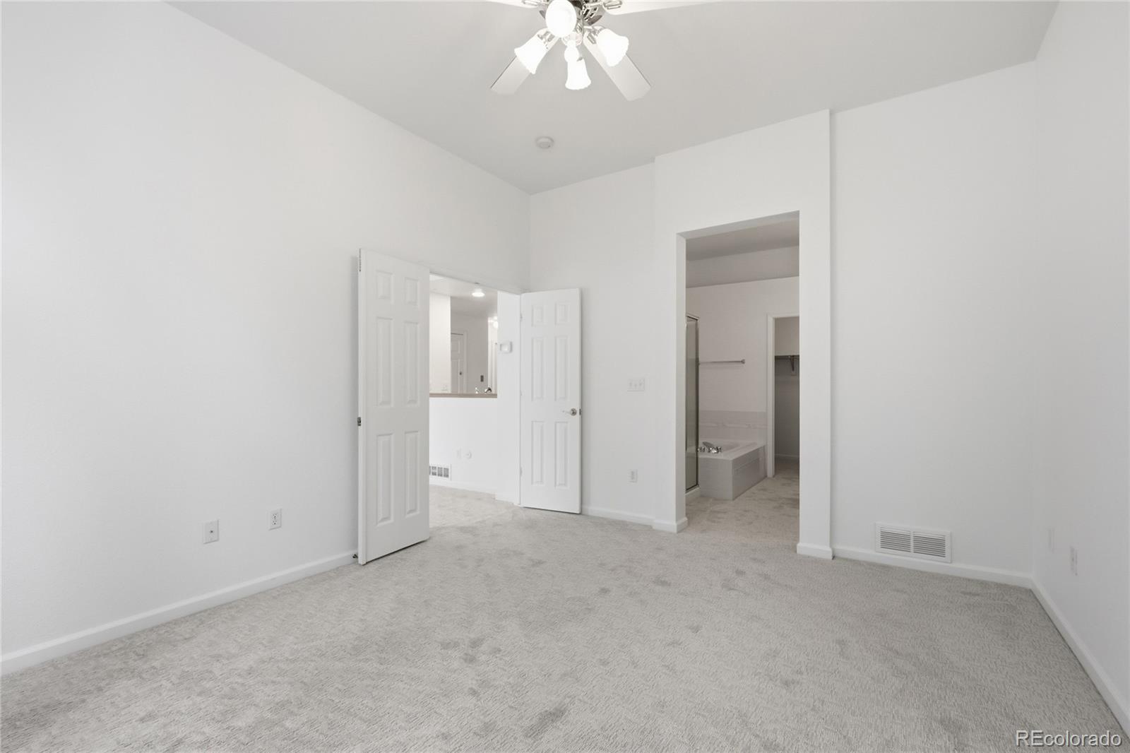 6383 Deframe Way Arvada, CO 80004 - Photo 21 of 49 an empty room with a bathroom