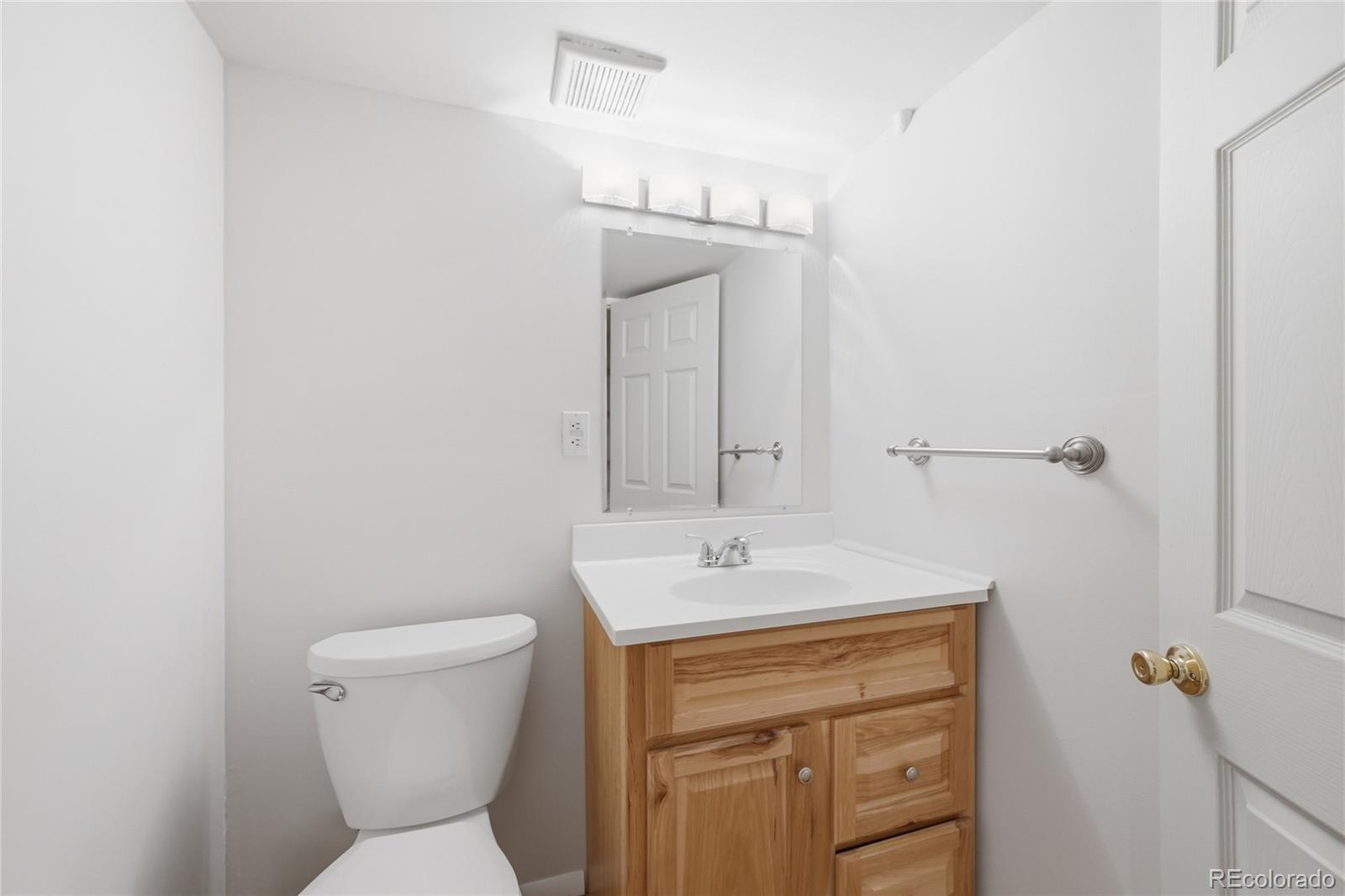 6383 Deframe Way Arvada, CO 80004 - Photo 30 of 49 a bathroom with a sink toilet and shower