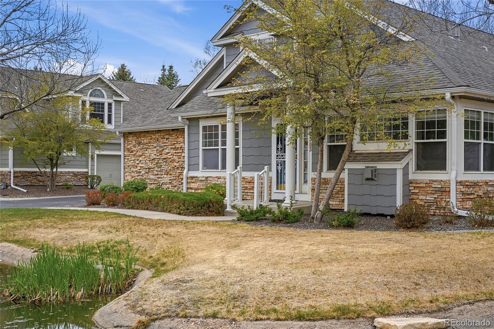 6383 Deframe Way Arvada, CO 80004 - Photo 3 of 49 a front view of a house with a yard