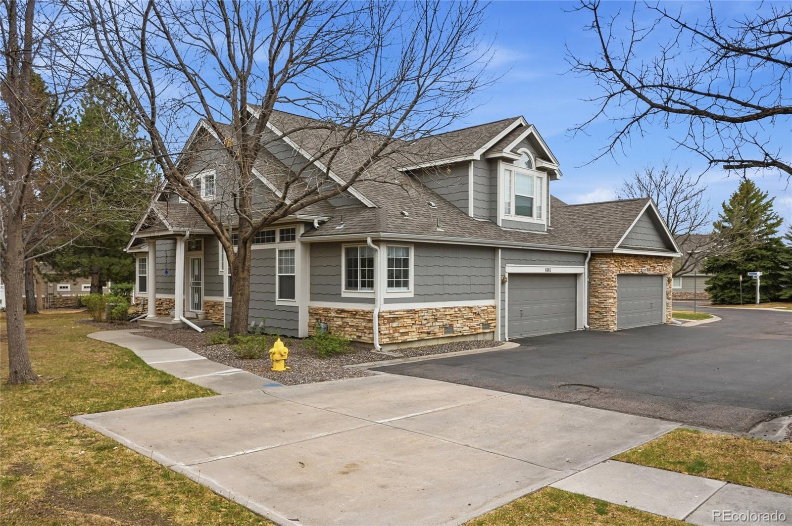 6383 Deframe Way Arvada, CO 80004 - Photo 35 of 49 a front view of a house with a yard