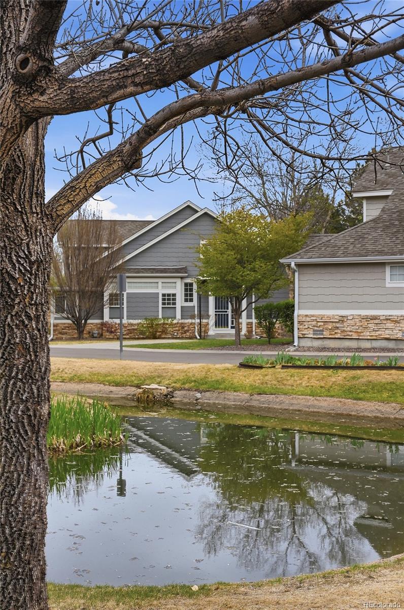 6383 Deframe Way Arvada, CO 80004 - Photo 40 of 49 a view of a house with a swimming pool