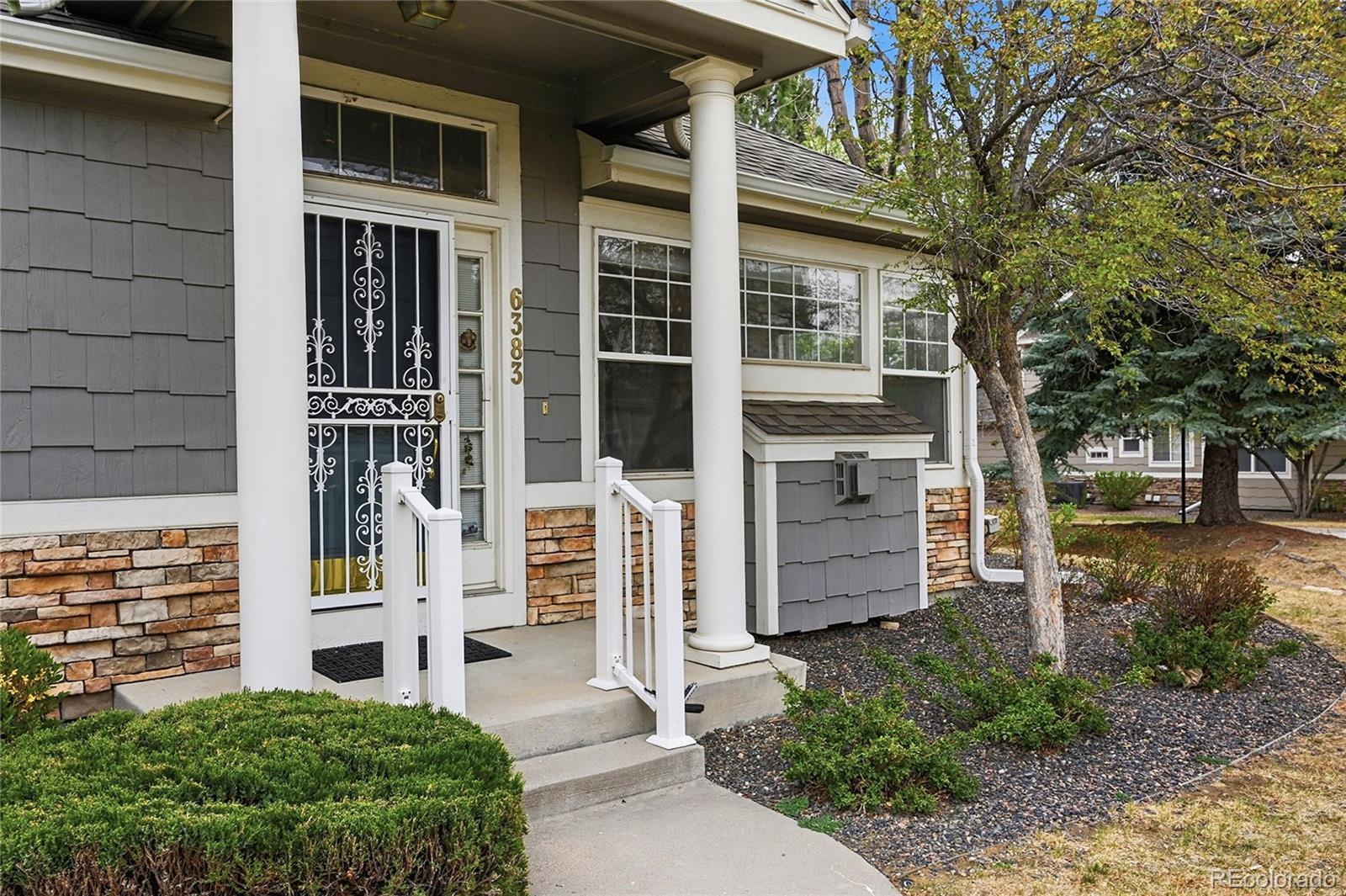 6383 Deframe Way Arvada, CO 80004 - Photo 41 of 49 front view of a house with a yard
