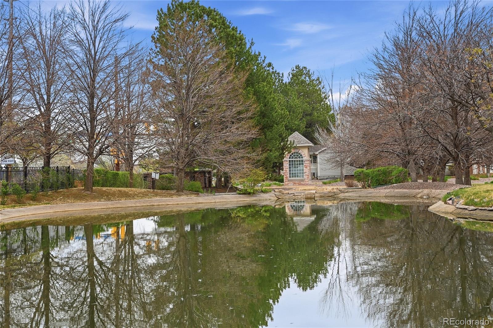 6383 Deframe Way Arvada, CO 80004 - Photo 42 of 49 a view of swimming pool from a lake view