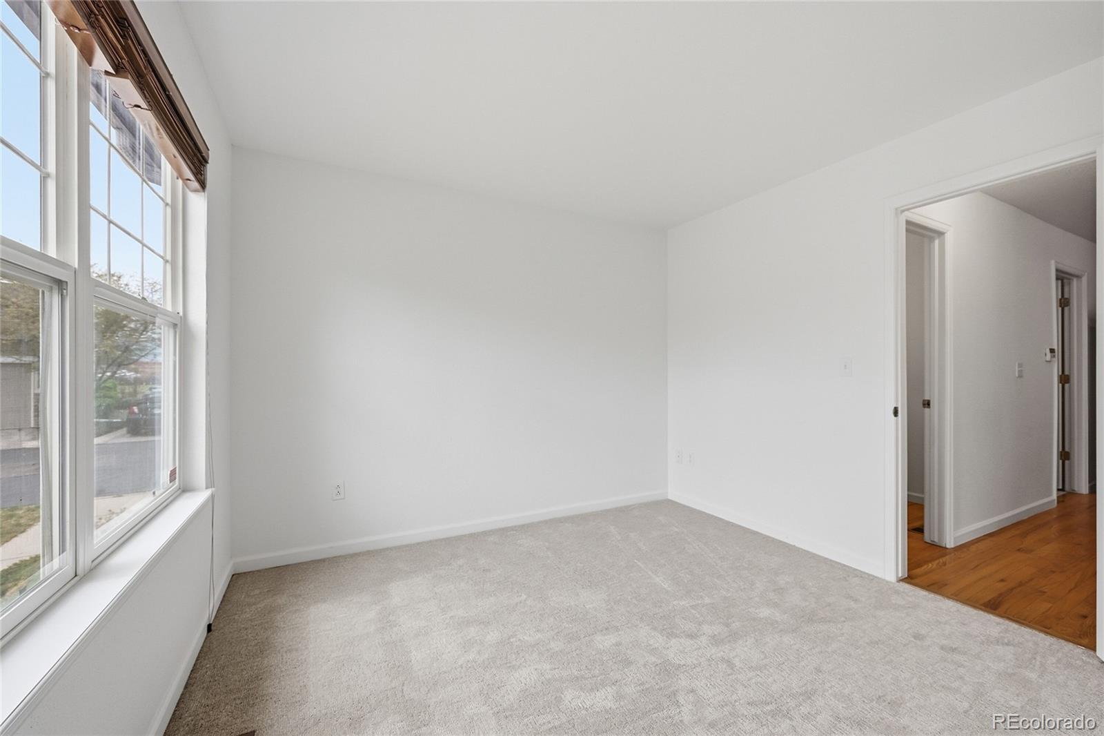 6383 Deframe Way Arvada, CO 80004 - Photo 5 of 49 an empty room with a window