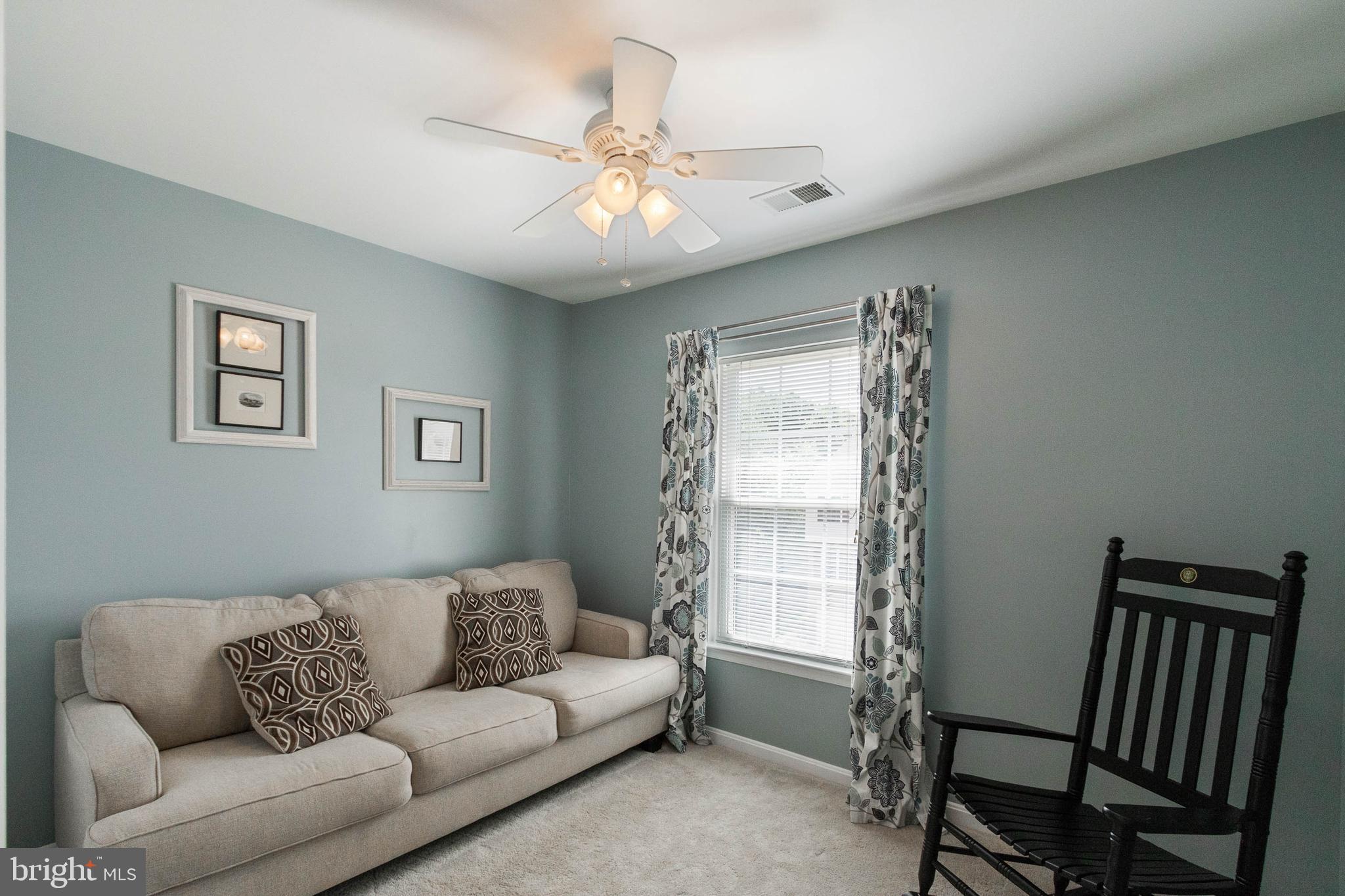20385 Farmgate Terrace Ashburn, VA 20147 - Photo 18 of 27 a living room with furniture and a window