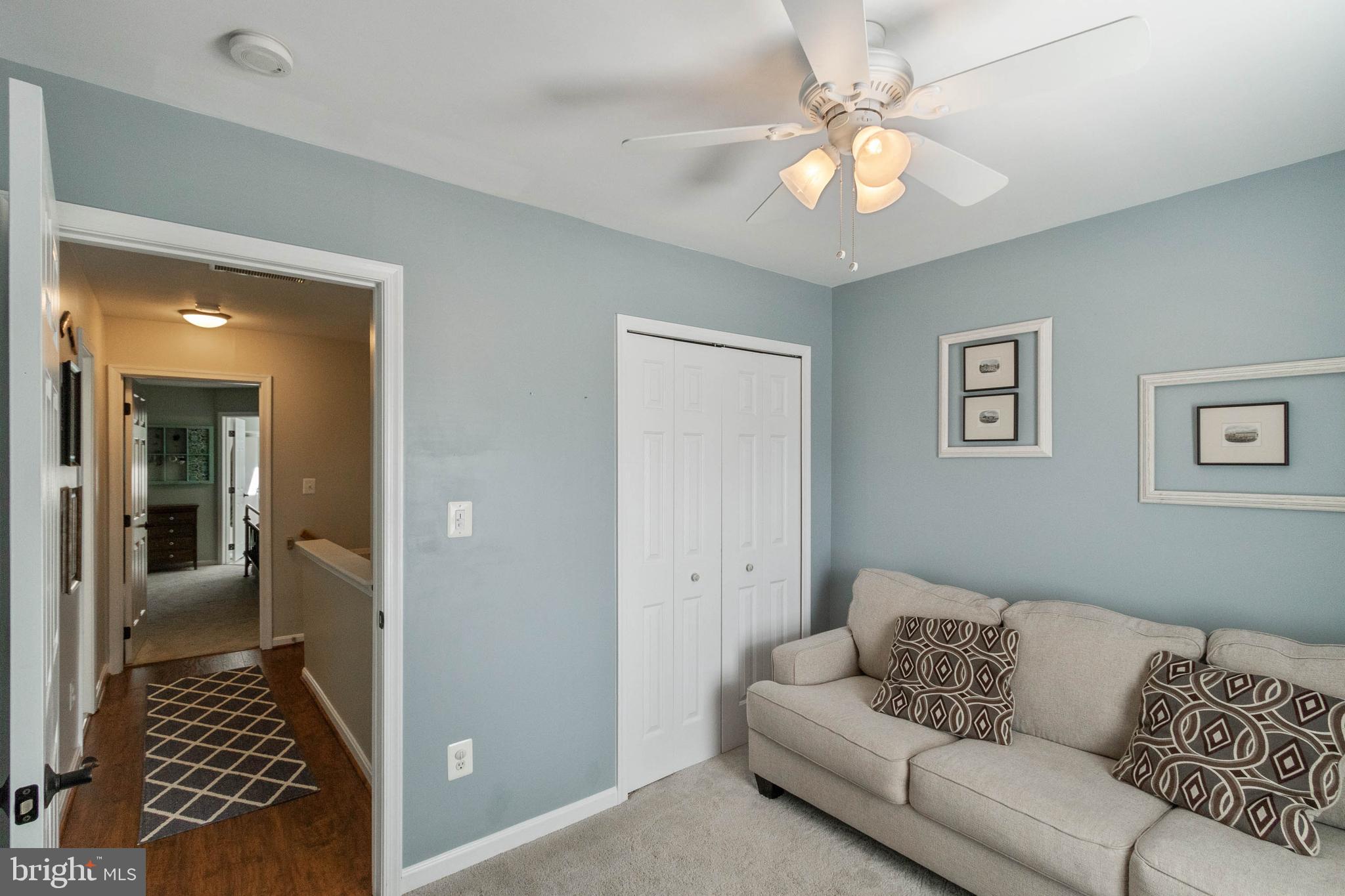 20385 Farmgate Terrace Ashburn, VA 20147 - Photo 19 of 27 a living room with furniture and a rug