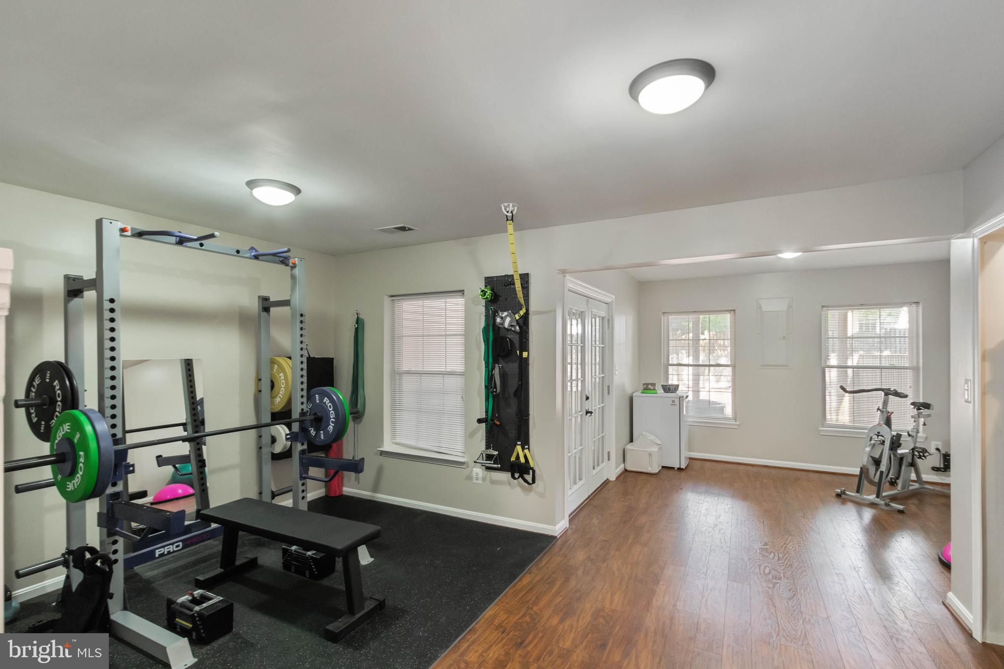 20385 Farmgate Terrace Ashburn, VA 20147 - Photo 20 of 27 a view of a room with gym equipment and a wooden floor